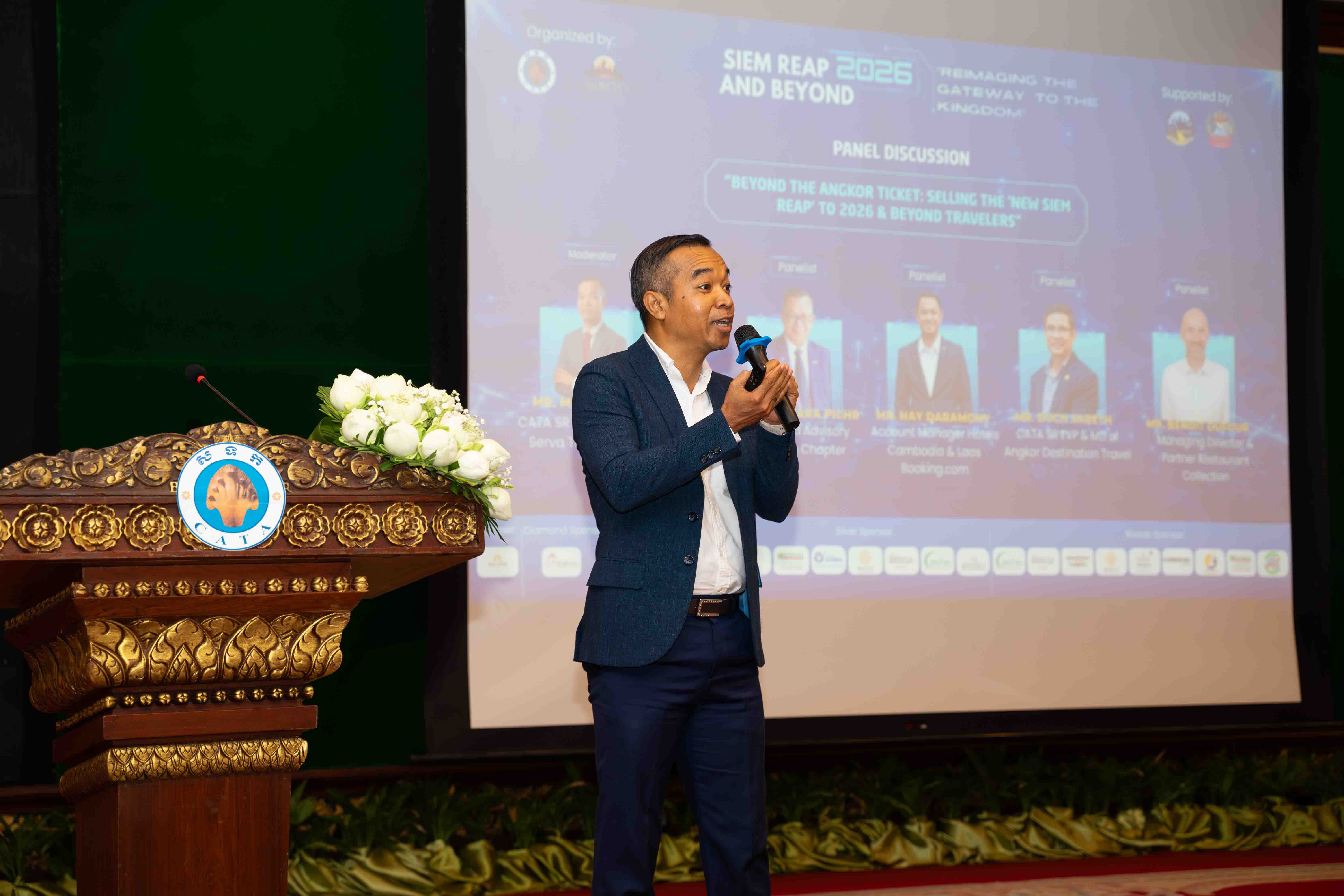 Savath MAO speaking on stage as CATA Siem Reap President, representing Serva Travel and tourism leadership in Cambodia